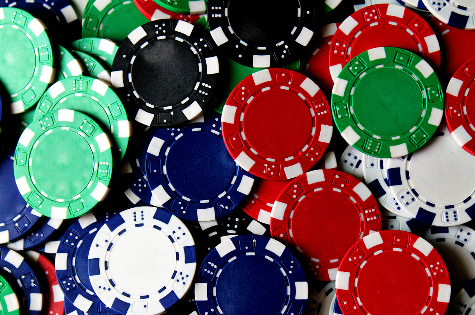 poker chips laying on a card table