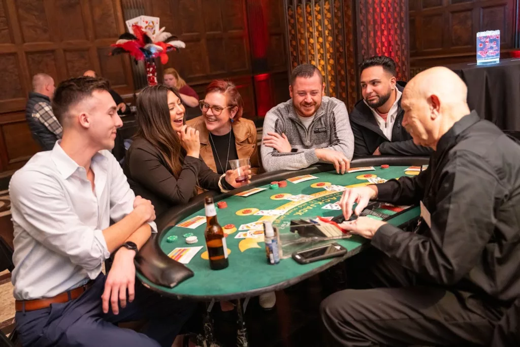 guests playing blackjack with dealer